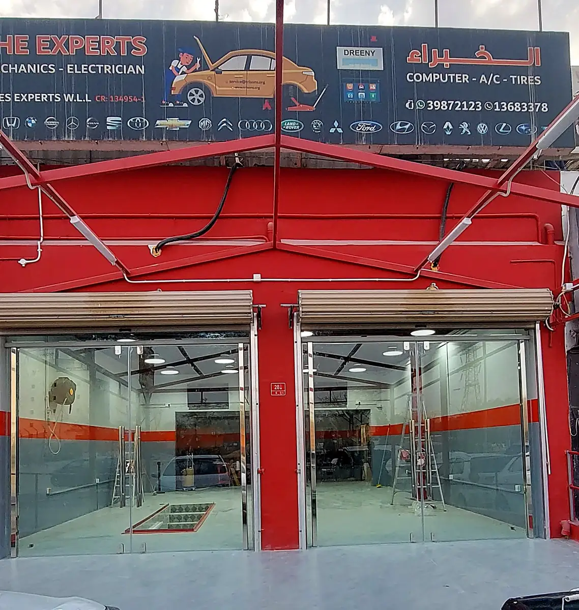 Glass and aluminium shopfront with red frame